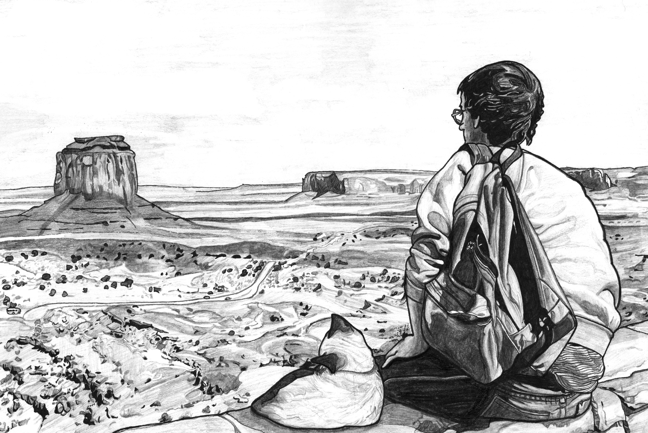 The artist David Wojnarowicz is sitting on a mountain side with a small cat. They are looking out over a desert view.